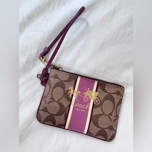 Cute Coach wristlet in berry/pink/purple